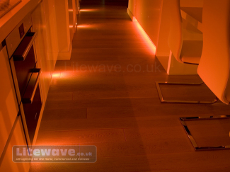 RGB Spotlight illuminating the kitchen Floor in Orange