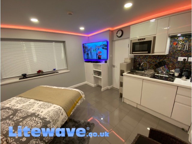 Wall Uplighting Kit in Bedroom - displaying pastel Orange