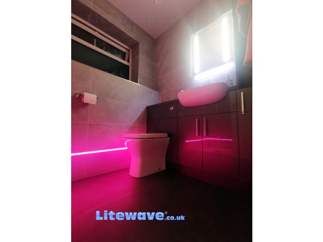 LED Lights set into tiles towards vanity unit