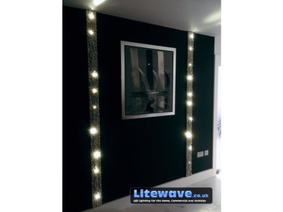 A Wall illuminated with Mini LED Screw Lights